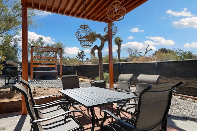 view of patio with area for grilling and a hot tub