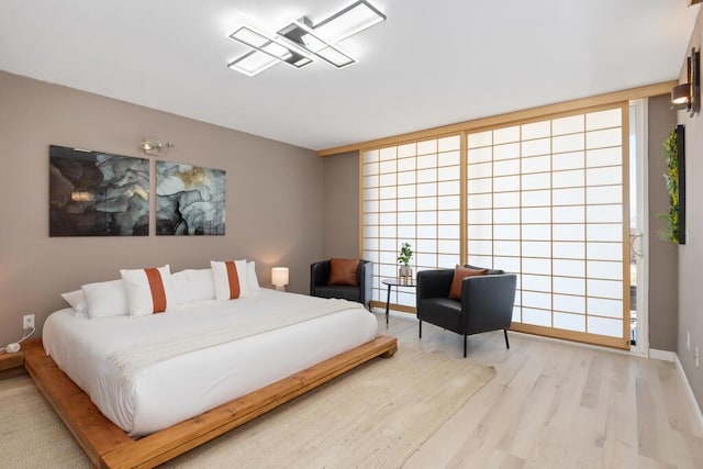 bedroom featuring light wood-type flooring