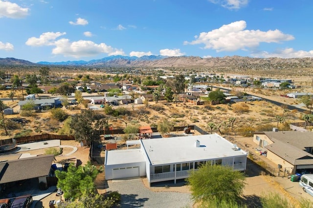 birds eye view of property featuring a mountain view