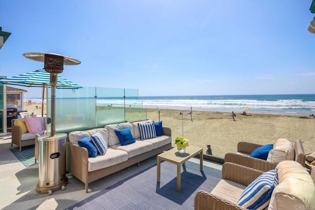 view of patio featuring a view of the beach, grilling area, a water view, and an outdoor hangout area