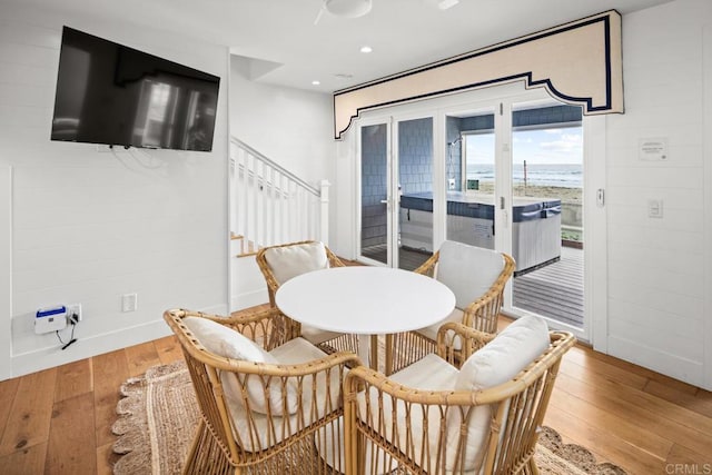 dining space with stairway, recessed lighting, baseboards, and hardwood / wood-style flooring