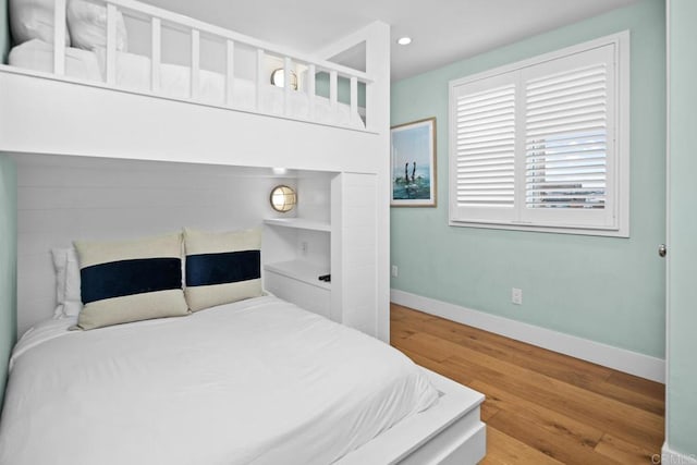 bedroom featuring recessed lighting, baseboards, and wood finished floors