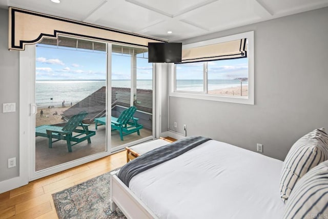 bedroom with baseboards, coffered ceiling, recessed lighting, hardwood / wood-style flooring, and access to outside