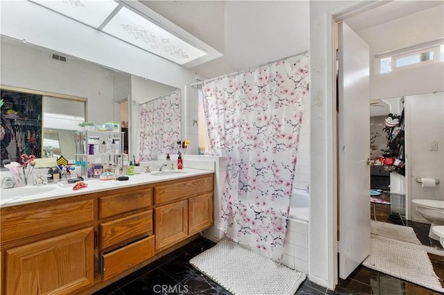 full bathroom with tile patterned floors, vanity, toilet, and shower / bathtub combination with curtain