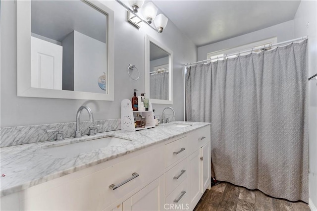 bathroom featuring vanity, wood-type flooring, and a shower with shower curtain