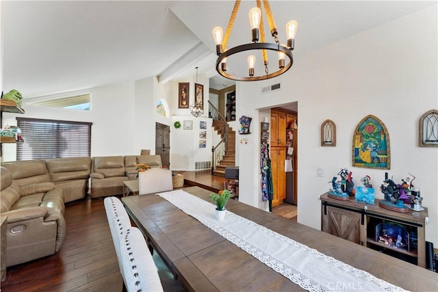 dining room featuring a chandelier, beam ceiling, dark hardwood / wood-style floors, and high vaulted ceiling