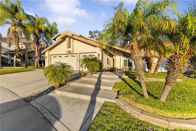 mediterranean / spanish-style house with a garage