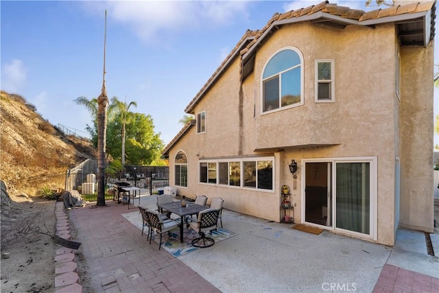 back of property featuring a patio area