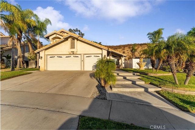 view of front of property with a garage