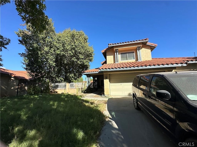 view of front of home featuring a front yard and a garage