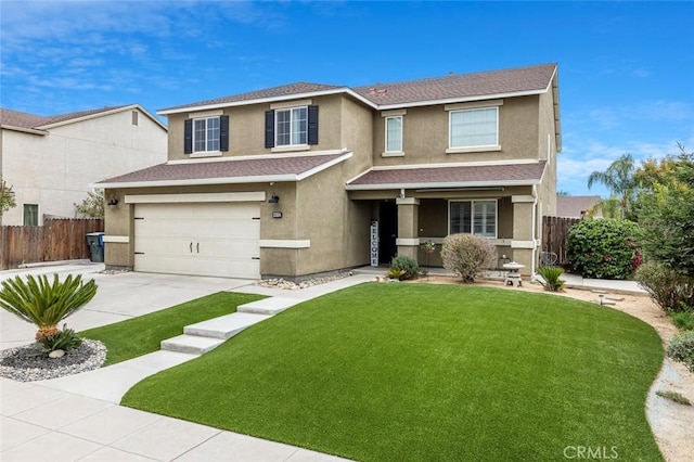 front of property featuring a front lawn and a garage