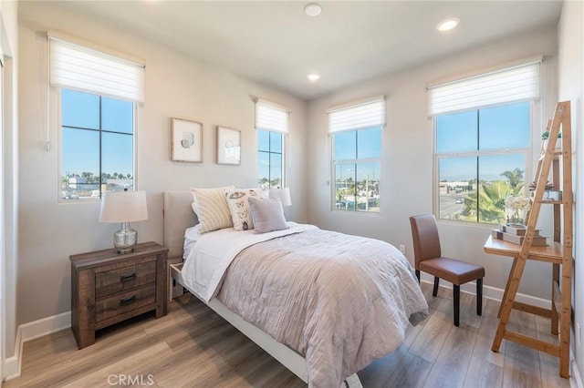 bedroom with hardwood / wood-style flooring