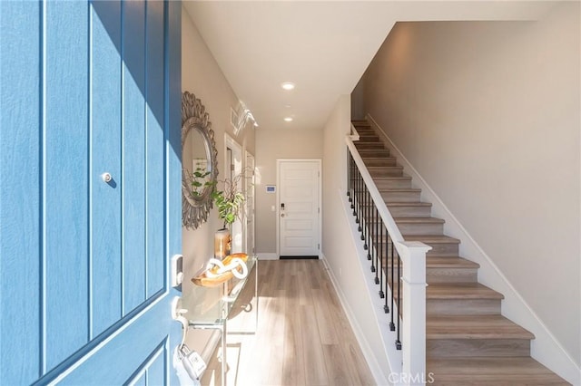 entrance foyer featuring wood-type flooring