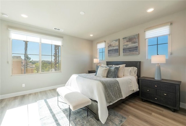 bedroom with light wood-type flooring