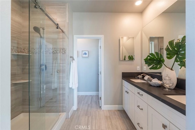 bathroom with vanity and an enclosed shower