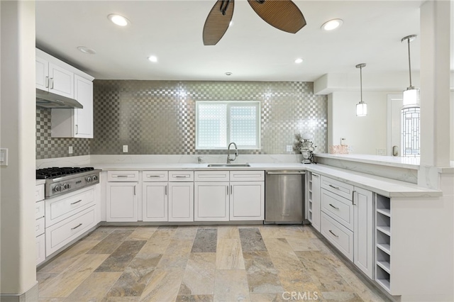 kitchen featuring white cabinets, sink, appliances with stainless steel finishes, and tasteful backsplash