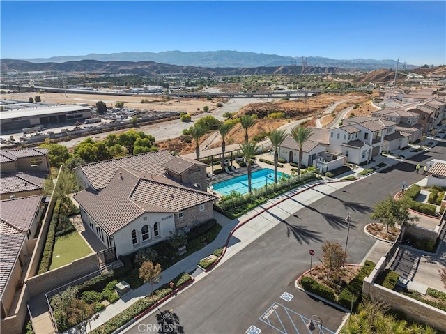 birds eye view of property with a mountain view