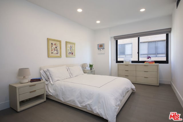 bedroom featuring dark hardwood / wood-style floors