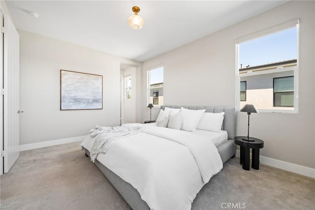 bedroom with light colored carpet