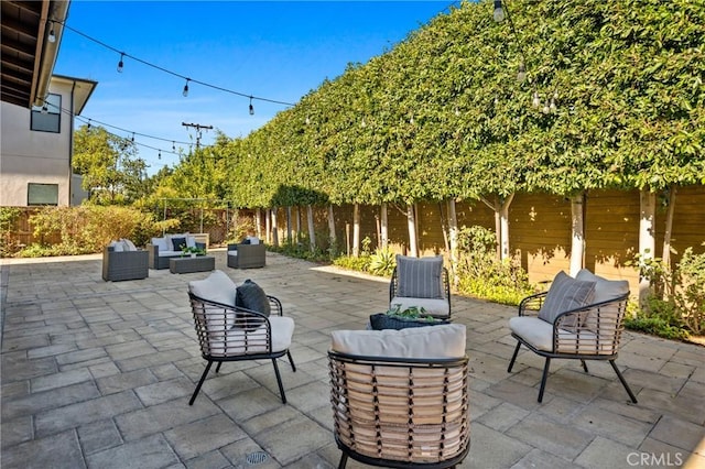 view of patio featuring a fenced backyard and an outdoor living space