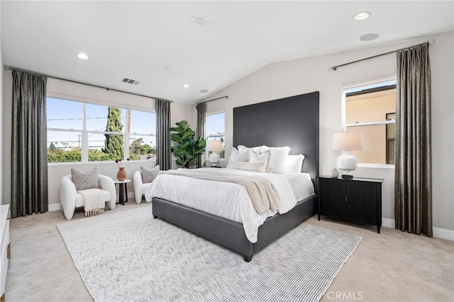 bedroom with recessed lighting, light colored carpet, vaulted ceiling, and baseboards