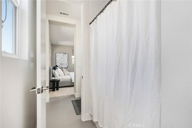 bathroom featuring tile patterned flooring