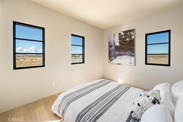 bedroom with light wood-type flooring