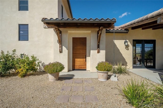 property entrance featuring french doors