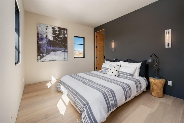 bedroom featuring light wood-type flooring