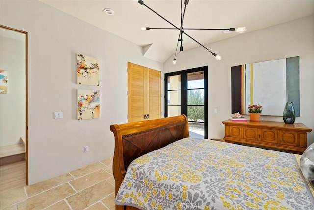 bedroom with a chandelier, access to exterior, and vaulted ceiling