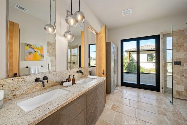 bathroom with vanity and walk in shower