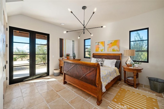 bedroom featuring access to exterior, french doors, vaulted ceiling, and a notable chandelier