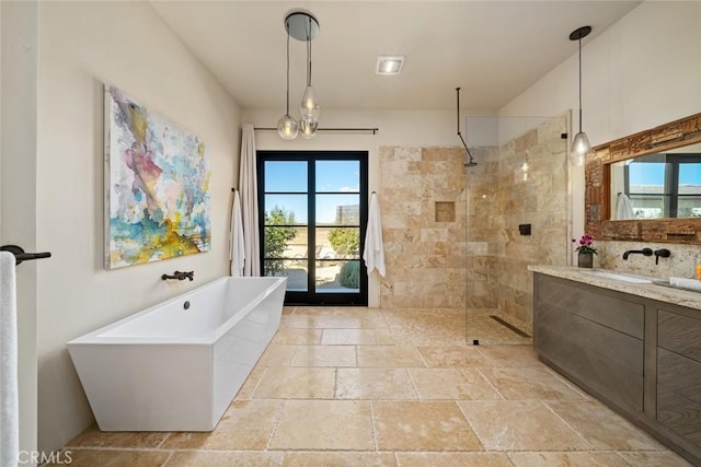 bathroom featuring vanity and separate shower and tub