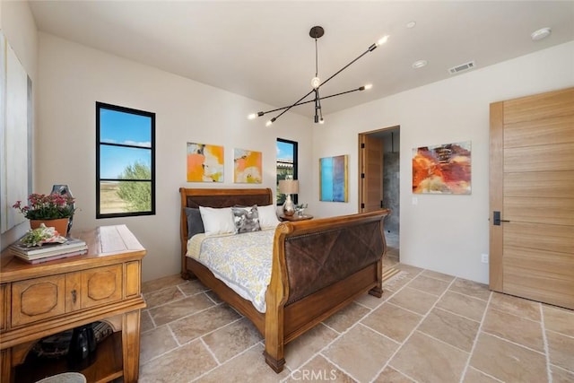 bedroom with an inviting chandelier