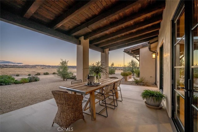 view of patio terrace at dusk