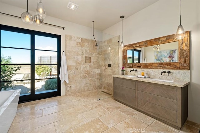 bathroom with backsplash, vanity, and shower with separate bathtub