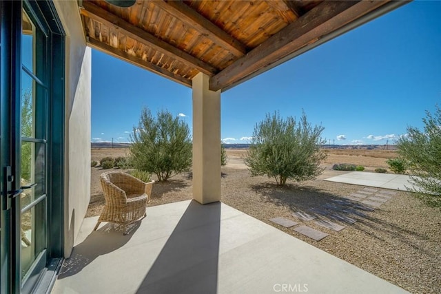 view of patio / terrace with a rural view