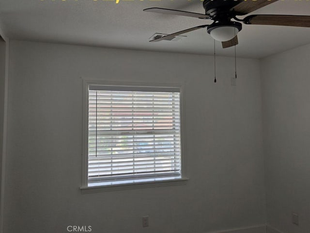 unfurnished room with ceiling fan