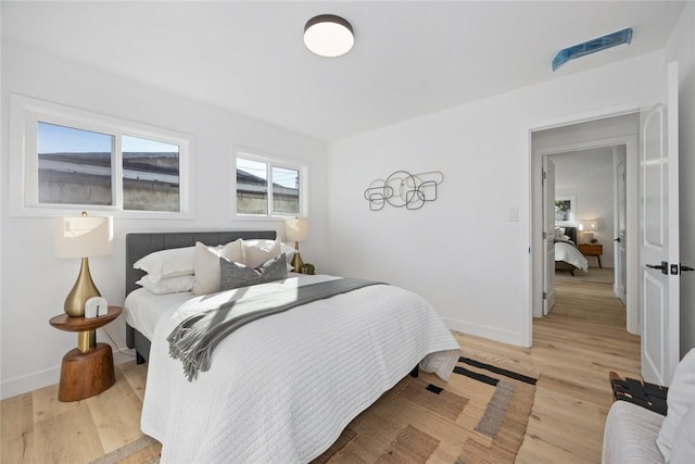 bedroom with light wood-type flooring