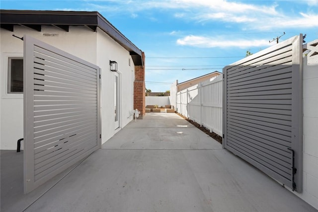 view of side of home featuring a patio