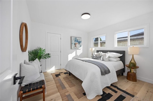 bedroom with light hardwood / wood-style floors