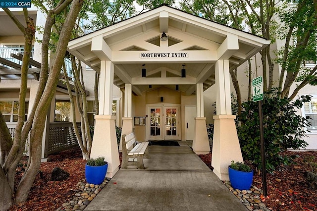 view of exterior entry featuring french doors