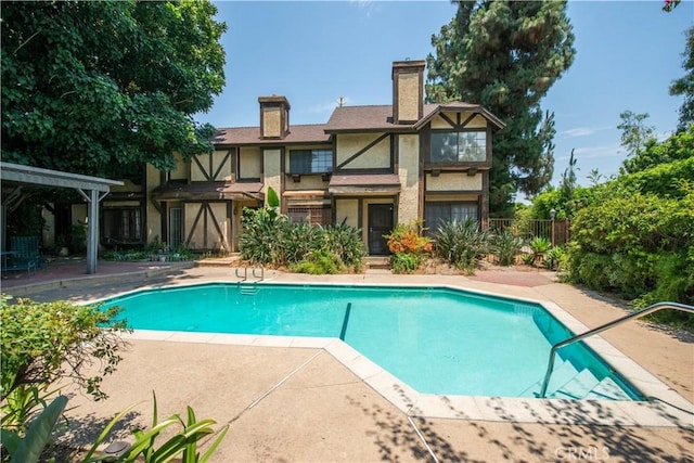 view of pool featuring a patio