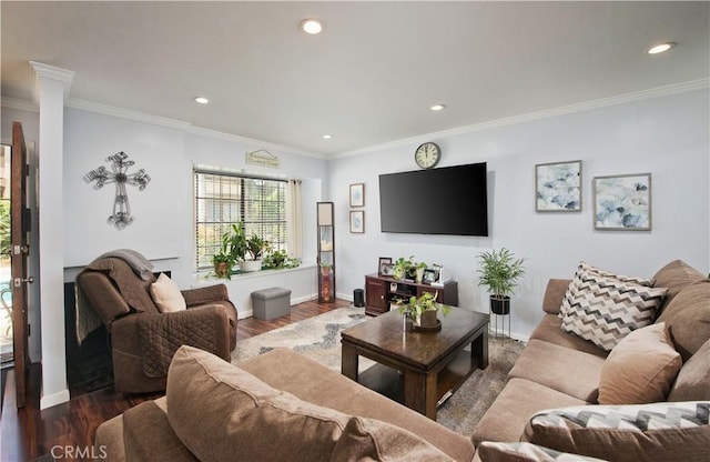 living room with dark hardwood / wood-style flooring and ornamental molding