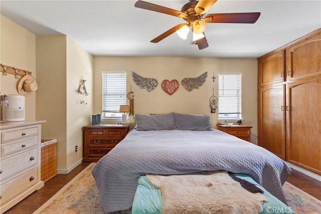 bedroom featuring dark hardwood / wood-style floors and ceiling fan