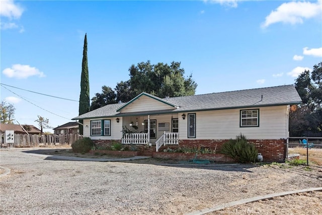 single story home with covered porch