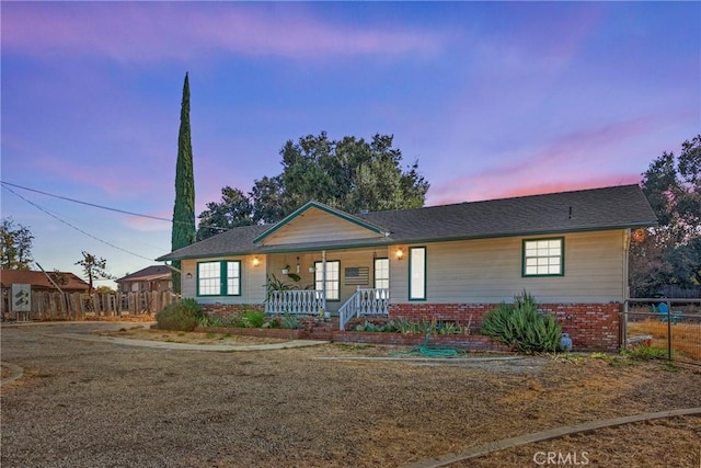 single story home with covered porch