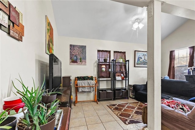 living room with lofted ceiling and light tile patterned flooring