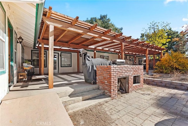 view of patio / terrace with a pergola and exterior kitchen