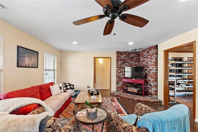 living room with dark hardwood / wood-style floors and ceiling fan